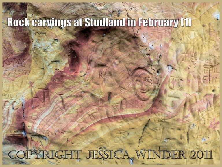P1110211Blog1 Graffiti carved into the soft red and yellow striped sandstone cliffs at Studland Bay, Dorset, UK on the Jurassic Coast World Heritage Site (1)
