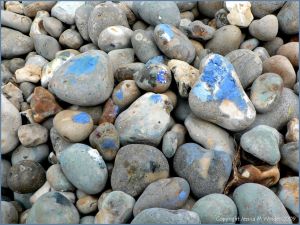 Paint on pebbles at the beach