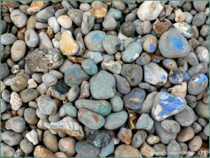Paint on pebbles at the beach