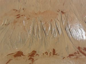 Natural patterns in the sand on the beach