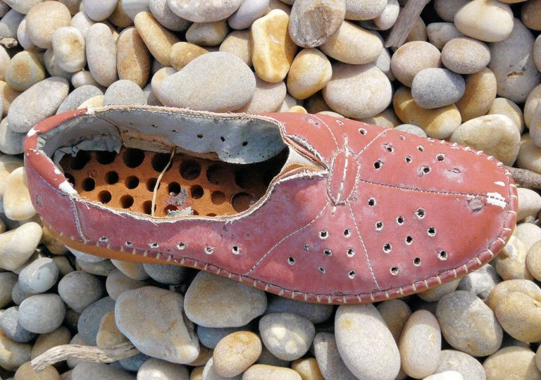 P1080740b Shoe on the strandline of Chesil Beach near Portland, Dorset, UK P1080740b Shoe on the strandline of Chesil Beach near Portland, Dorset, UK