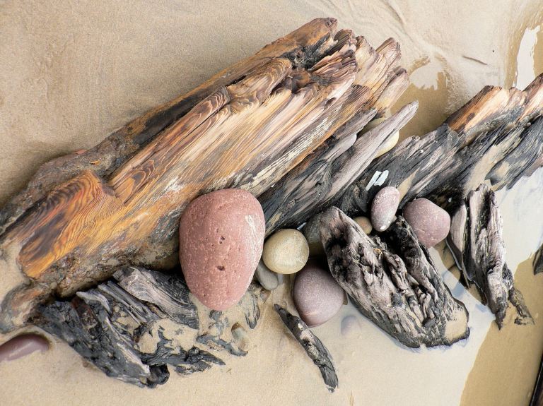 Wooden ribs rising from the keel of an old wrecked ship on Rhossili seashore (3), Gower, South Wales. Wooden ribs rising from the keel of an old wrecked ship on Rhossili seashore (3), Gower, South Wales.