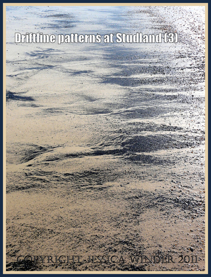 Pattern in nature: Driftline pattern of black charcoal on the sandy beach at Studland Bay owned by the National Trust in Dorset, UK, on the Jurassic Coast (P1070058aBlog3)