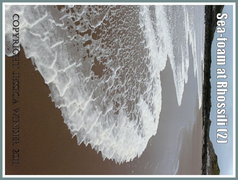 Seashore picture with seafoam: Sea-foam pushed by the wind up the sandy beach at Rhossili Bay, Gower, South Wales, UK (P1440242aBlog2)