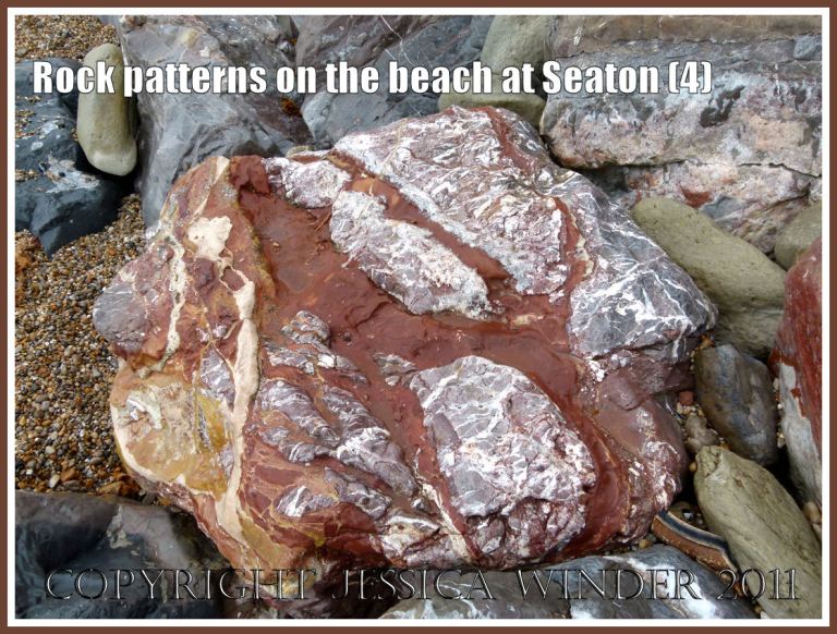 Seaton rock pattern: Natural red and white pattern on the top of the same large boulder that forms part of the rock armour preventing erosion on the beach at Seaton, Devon, U.K. - part of the Jurassic Coast World Heritage Site (4)