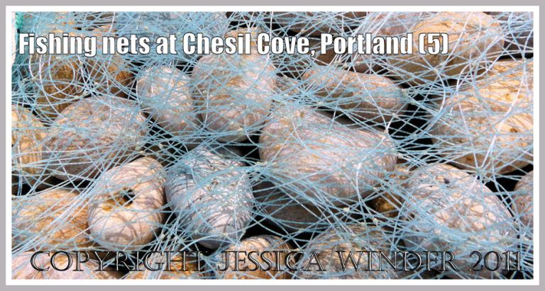 Blue fishing nets drying on flint and chert pebbles at Chesil Cove, Portland, Dorset, UK - part of the Jurassic Coast (5)