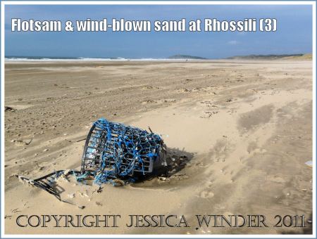 Flotsam on Rhossili Beach: Lobster pot flotsam on the sandy beach at Rhossili, Gower, South Wales, UK (3)