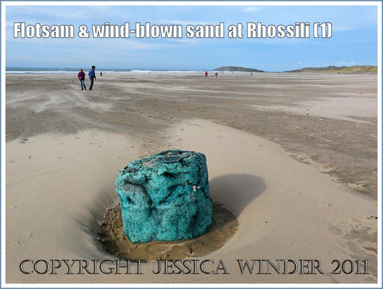 Flotsam on Rhossili beach: Flotsam (melted fishing nets) on the sandy beach at Rhossili Bay, Gower, South Wales, UK (1)