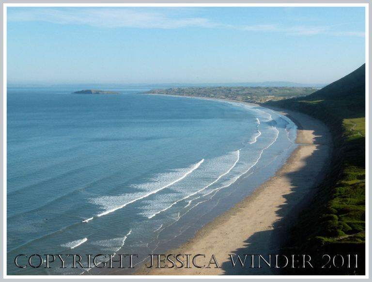 Rhossili Bay with the island of Burry Holms in the distance