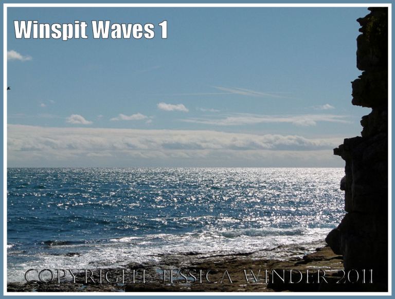 Sparkling waves seen from the rock ledge on the shore at Winspit, Dorset, UK, on the Jurassic Coast - site of ancient quarrying activities.