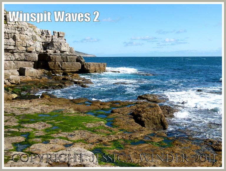 The waves breaking on the man-made rock ledge at Winspit, Dorset, UK on the Jurassic Coast.