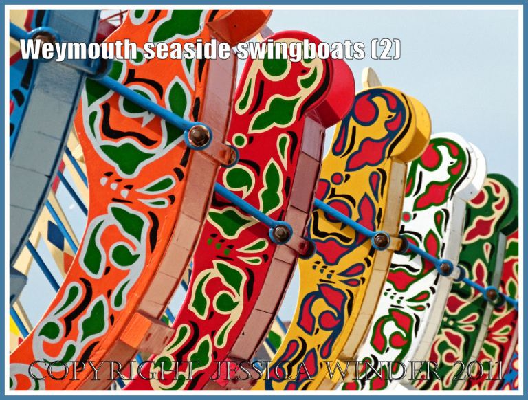 Brightly painted swingboats on the golden sands at Weymouth, Dorset, UK (2)