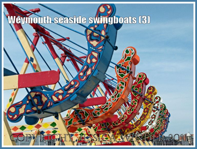Brightly painted swingboats on the golden sands at Weymouth, Dorset, UK (3)