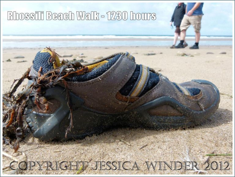 Rhossili Beach Walk - 1230 hours. Brown and black trainer shoe washed ashore as flotsam on Rhossili Beach, Gower, South Wales, 22nd August, 2012.