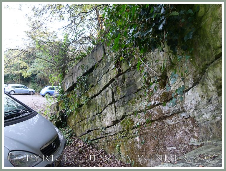 'Black Lias' at Clements Quarry 6 - The long-term car park at Oystermouth is located in the disused Clements Quarry with the Upper Carboniferous Oystermouth Formation of alternating bands of limestone and shales, where Mumbles Marble used to be quarried, , at Oystermouth, near Mumbles, Gower, South Wales. P1270576aBlog7