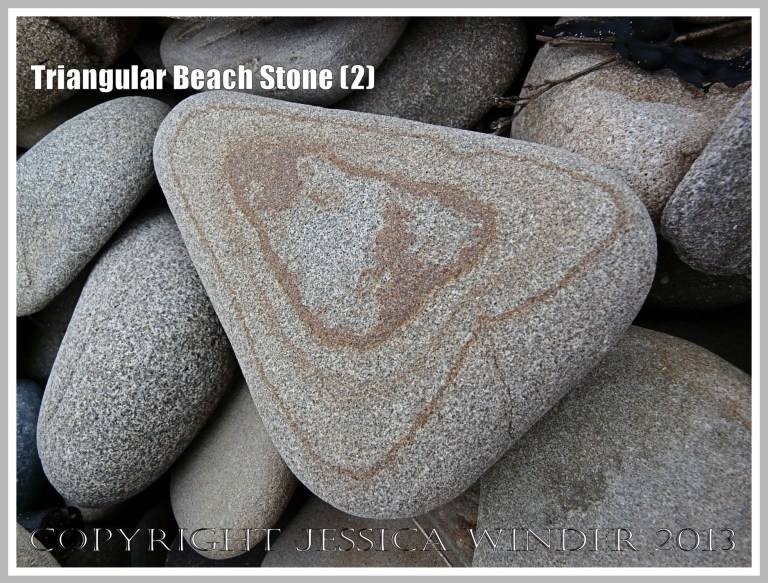 Triangular Beach Stone (2) - Natural triangular shape of a pebble or beach stone with a natural geometrical pattern. 