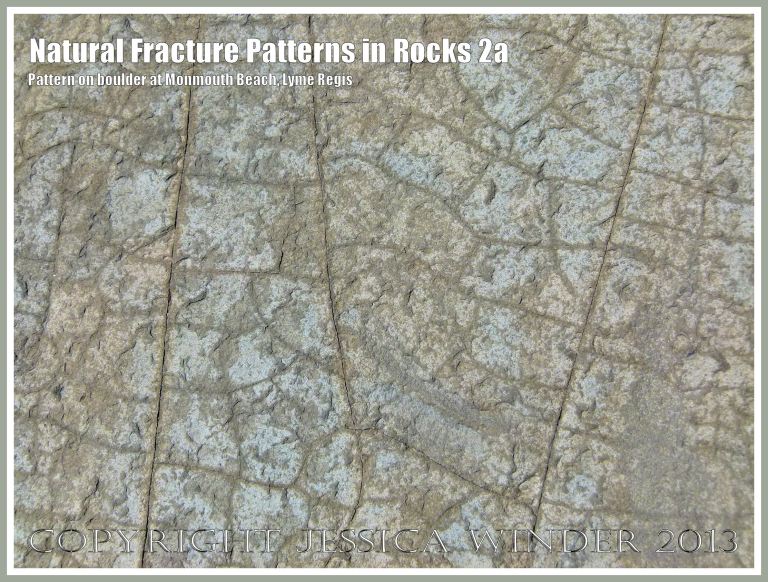 Natural Fracture Patterns in Rocks 2a - Close up photograph of natural patterns of cracks in a boulder on the shore at Monmouth Beach, Lyme Regis, Dorset, UK on the Jurassic Coast.