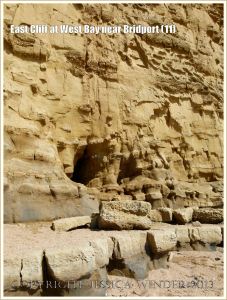 East Cliff at West Bay near Bridport (11) - Caves at the base of the cliff are created by wind and wave action widening and extending the crack in weakened rock of the vertical cambering joints.