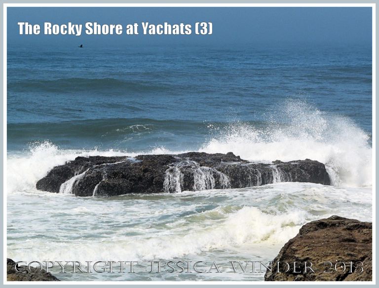 Waves crashing over rocky outcrop at Yachats