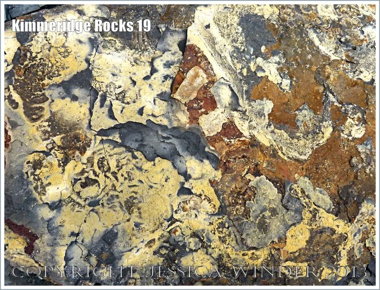 Iron and sulphur compound deposits on broken shale