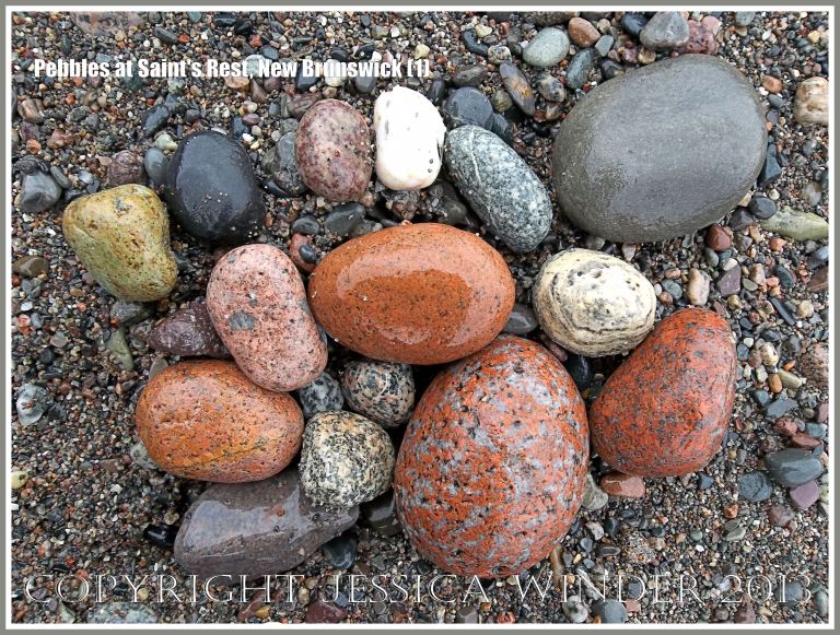 Natural patterns and colours in pebbles of mostly igneous rocks like granite on the shore at Saints Rest Beach, Irving Nature Park, New Brunswick, Canada.