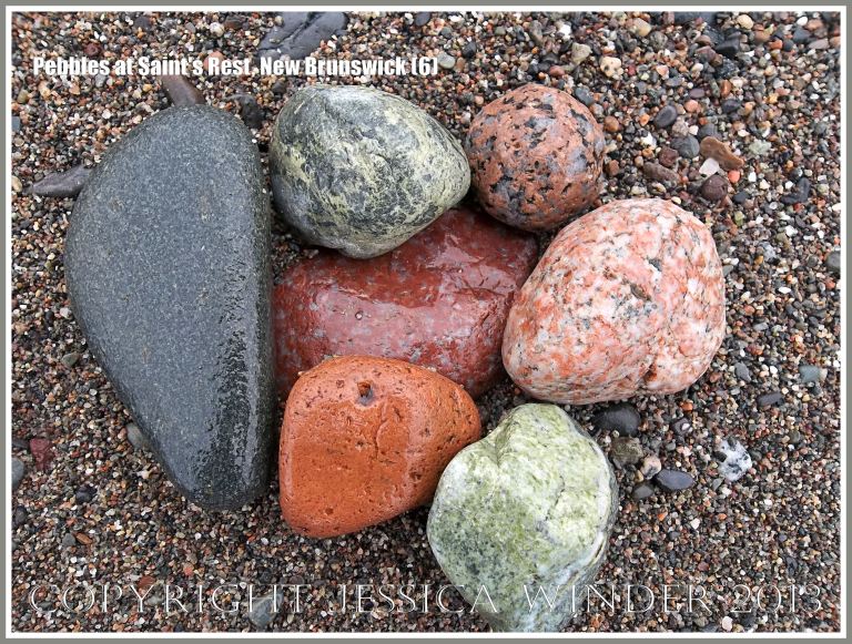Natural patterns and colours in pebbles of mostly igneous rocks like granite on the shore at Saints Rest Beach, Irving Nature Park, New Brunswick, Canada.