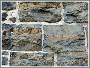 A wall of local meta-sedimentary rocks in one of the Historic Properties on the Halifax waterfront, Nova Scotia, Canada.