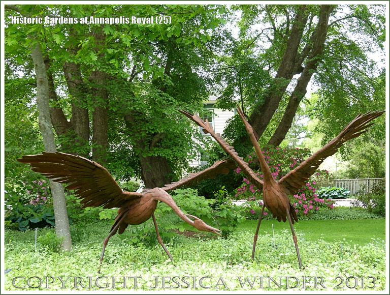Sculptures of cranes at Historic Gardens, Annapolis Royal, Nova Scotia, Canada.