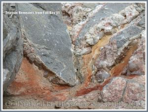 Red Triassic rock remnant with calcite crystal in faulted Carboniferous limestone.