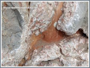 Red Triassic rock remnant with calcite crystal in faulted Carboniferous limestone.