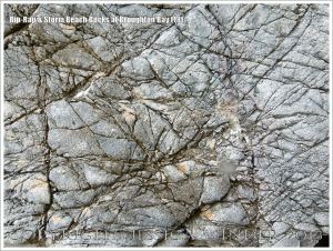 Detail of a boulder on the beach used as a defence against coastal erosion