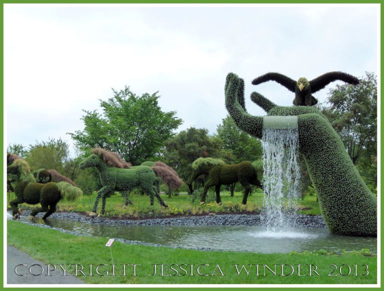 Mosaiculture tableau of sculptures made with living plants entitled "Mother Earth"