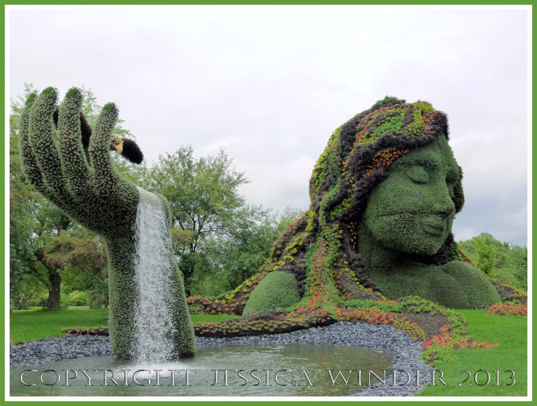Mosaiculture tableau of sculptures made with living plants entitled "Mother Earth"