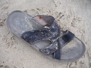 Lost sandal on the beach