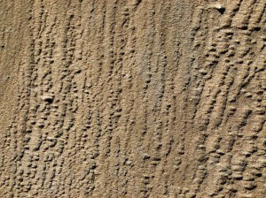 Patterns and textures created on the seashore by wind-blown sand