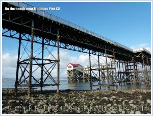 View of the old Life Boat Station through the girderwork supporting Mumbles Pier