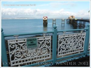 View of the pier and Life Boat Station from ornamental railings at Mumbles Pier, near Swansea, South Wales.