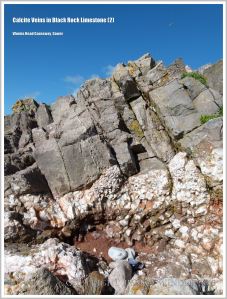 White calcite crystals with red haematite in limestone rocks