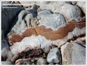 Red and white lines in grey rocks