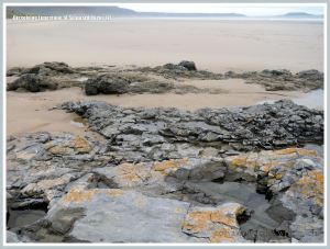 General view from Spaniard Rocks across Rhossili beach to Worms Head