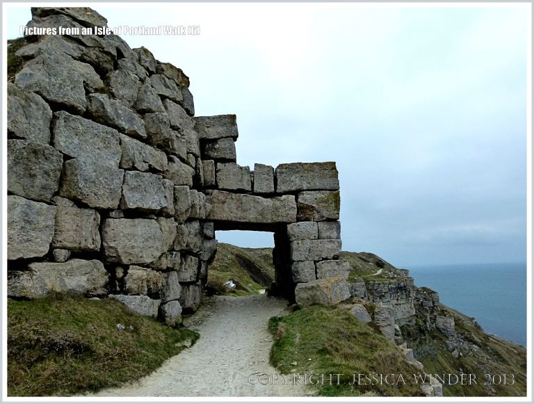 Stone wall and arch over the coastal path on the western edge of the Isle of Portland