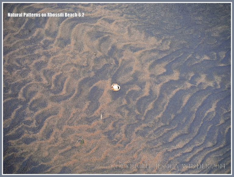 Natural patterns in the sand left by the out-going tide
