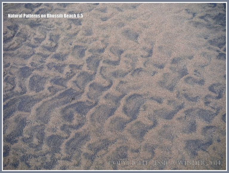 Natural patterns in the sand left by the out-going tide