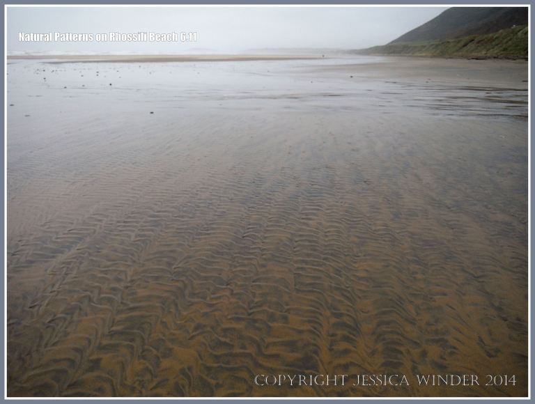 Natural patterns in the sand left by the out-going tide