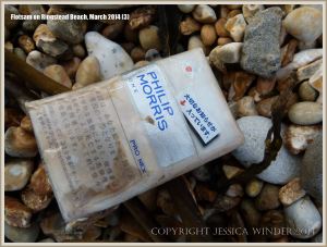 Flotsam packet of cigarettes washed ashore at Ringstead Bay