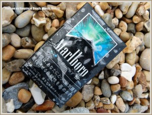 Flotsam packet of cigarettes washed ashore at Ringstead Bay