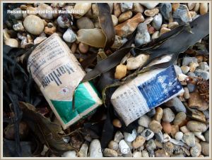 Flotsam packets of cigarettes washed ashore at Ringstead Bay