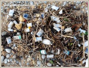 Flotsam packets of cigarettes washed ashore at Ringstead Bay