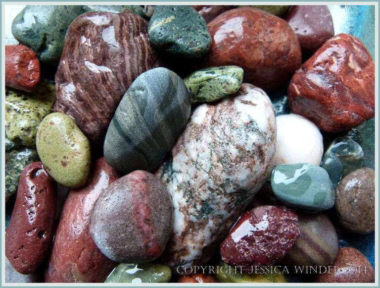 An assortment of patterned and coloured pebbles