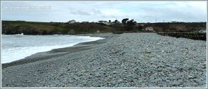 Pebble bank on the seashore retained by a seawall